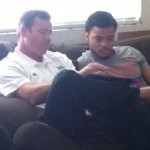 Nate Meadors watches his highlight tape with UCLA coach Jim Mora on Jan. 22.