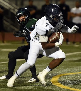 "Summit's Stephen Carr carries the ball against Kaiser defense at Kaiser High School in Fontana, CA, Friday, October 24, 2014. (Photo by Jennifer Cappuccio Maher/Inland Valley Daily Bulletin)"