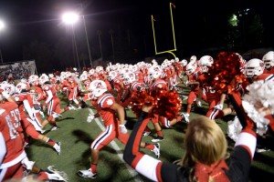 "The Redlands East Valley football team enters the field during the 18th Smudge Pot football game against Redlands High School on Friday, September 26, 2014 in Redlands, Ca. (Micah Escamilla/Redlands Daily Facts)"