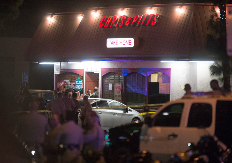 Los Angeles County Sheriff's with other police agencies stand outside the Chris & Pitts restaurants where deputies shot and killed the carjacking suspett in Downey on Thursday September 10, 2015. (Photo by Keith Durflinger/Whittier Daily News)