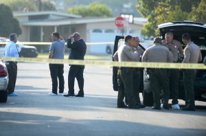 Los Angeles County Sheriff's deputies investigate the early morning stabbing death of a 16-year-old girl on the 9800-block of Shade Lane in Pico Rivera on Friday August 12, 2016. Investigators are looking for the former boyfriend of the girl. (Photo by Keith Durflinger/Whittier Daily News)