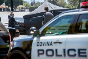 A man was found fatally shot inside a Honda Civic in the parking lot of Faith Community Church on San Bernardino Road in West Covina Saturday August 13, 2016. Police have the victim's body covered by a tent awaiting the Coroner Department's arrival. (Photo by Leo Jarzomb/San Gabriel Valley Tribune)