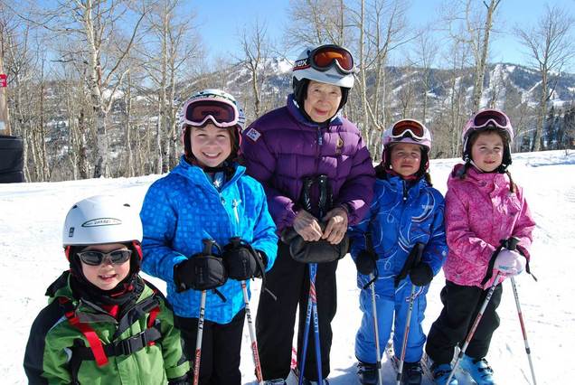 Dee Wang, 89, takes a break from skiing with her great-grandchildren in Park City, Utah. Wang is among the growing number of seniors on the slopes, according to the National Ski Areas Association, at a time when the number of skiers and boarders in other age groups have been holding steady or declining. (70 + Ski Club photo via Associated Press)