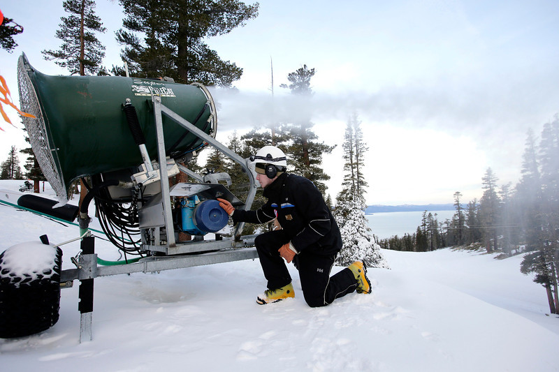 Daniel Crandall monitors a fan gun snowmaking machine on the upper slopes at Heavenly Mountain Resort in South Lake Tahoe, Calif. on Friday, Jan. 10, 2014. The lack of rainfall this winter has left the tourism trade in the Lake Tahoe area in shambles as ski resorts struggle to survive without snow. (Daniel Crandall monitors a fan gun snowmaking machine on the upper slopes at Heavenly Mountain Resort in South Lake Tahoe, Calif. on Friday, Jan. 10, 2014. The lack of rainfall this winter has left the tourism trade in the Lake Tahoe area in shambles as ski resorts struggle to survive without snow. (Gary Reyes/San Jose Mercury News)
