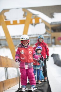 Children use one of the longest magic carpet rides in Canada during a lesson at Mont-Sainte-Anne's ski school.