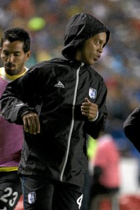 Queretaro's Ronaldinho warms up on the sidelines during a Mexican soccer league semi-final match against Pachuca in Queretaro, Sunday, May 24, 2015 (AP Photo/Christian Palma)