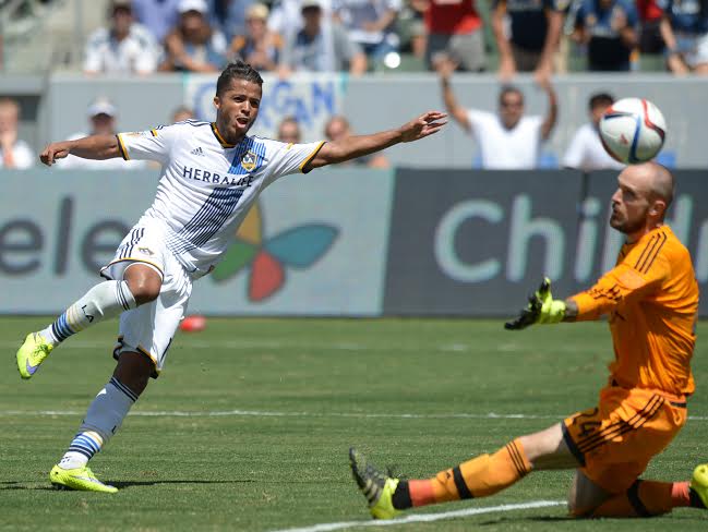 Galaxy's Giovani dos Santos gets the ball past Sounders' keeper Stefan Frei (24) for a goal in a MLS soccer game at the StubHub Center Sunday, August 09, 2015, Carson, CA.. The Galaxy won 3-1 and was the debut MLS game for Mexican star player Giovani dos Santos.Los Angeles Galaxy vs. Seattle SoundersPhoto by Steve McCrank/Staff Photographer