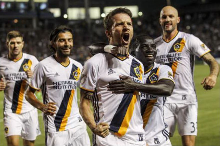 Mike Magee (center) celebrates his goal with Emmanuel Boateng in the Galaxy's 5-2 win over Real Salt Lake. (AP Photo/Ringo H.W. Chiu)