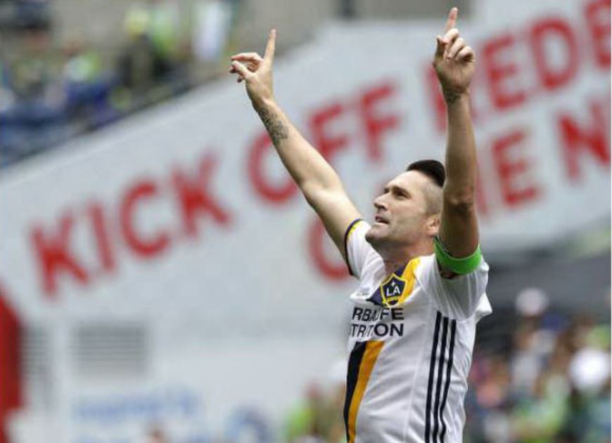 Los Angeles Galaxy forward Robbie Keane celebrates after he scored a goal against the Seattle Sounders in the first half of an MLS soccer match, Saturday, July 9, 2016 in Seattle. (AP Photo/Ted S. Warren)