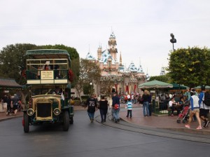 Oldtime bus passes Sleeping Beauty Castle at Disneyland 