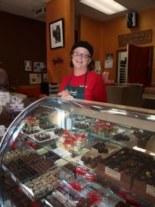 Owner Claudia Gilman displays some of the variety available at Trufflehound's Fine Chocolates.