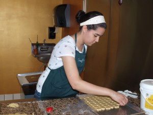 Ashley Butler cuts out marzipan hearts at Trufflehound's Fine Chocolates.