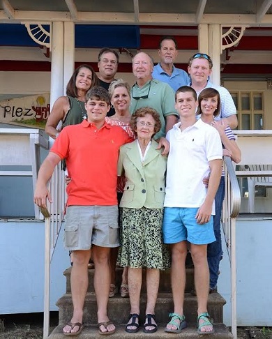 Jo Ann Tinsley-Rounsaville (second row, second from left) and her family at their fair cabin, the "Plez-zure Palace," named after her father, Plez, who built the cabin in 1966.
