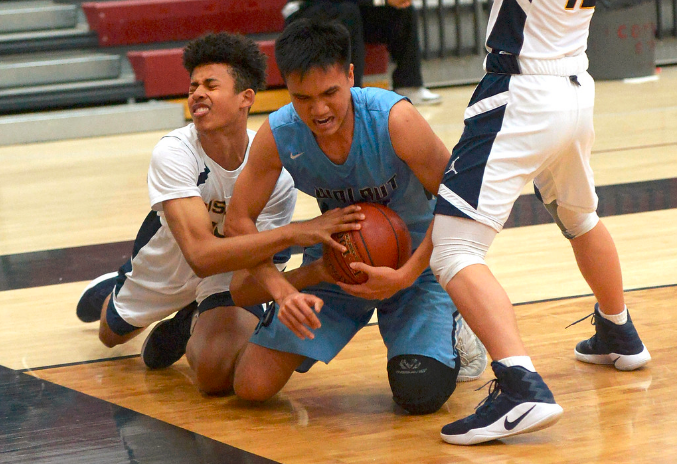 Walnut's Agassi Goantara (24) fights for the ball with JW North's Sadiq Muhammad as teammate Mason Westlake (12) looks on in the first half of a Covina Christmas Tournament prep basketball game at Covina High School in Covina, Calif., on Wednesday, Dec. 28, 2016.(Photo by Keith Birmingham, Pasadena Star-News/SCNG)