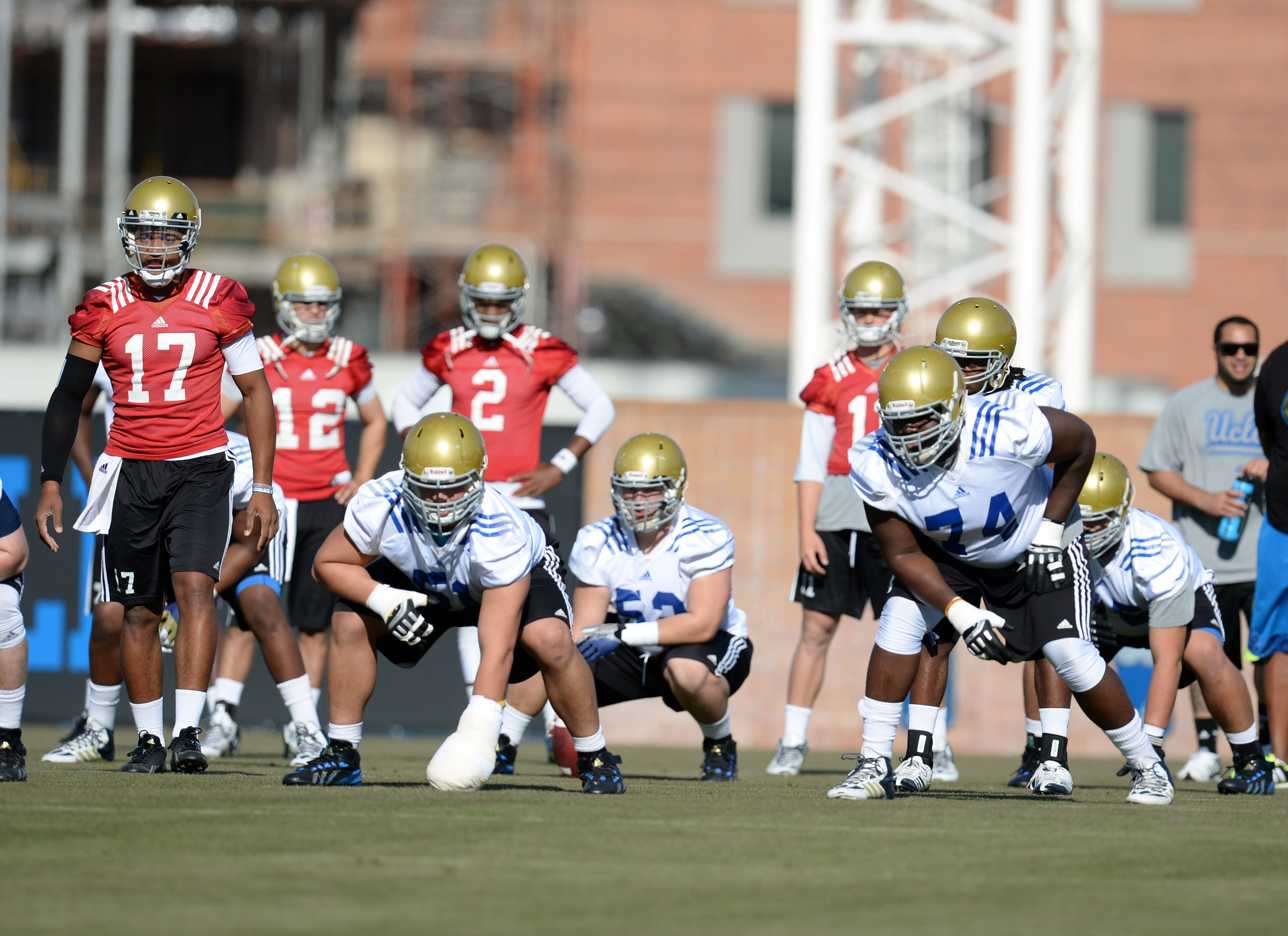 Brett Hundley (17) leads UCLA in a spring practice on April 3, 2014. With the quarterback now off the the NFL, the Bruins will spend this spring trying to find his successor. (Hans Gutknecht/Staff)