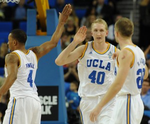 Thomas Welsh (40) celebrates with Norman Powell (4) and Bryce Alford as UCLA defeated USC 85-74 on March 4, 2015.  The teams could face each other again in Las Vegas. (John McCoy/Staff)