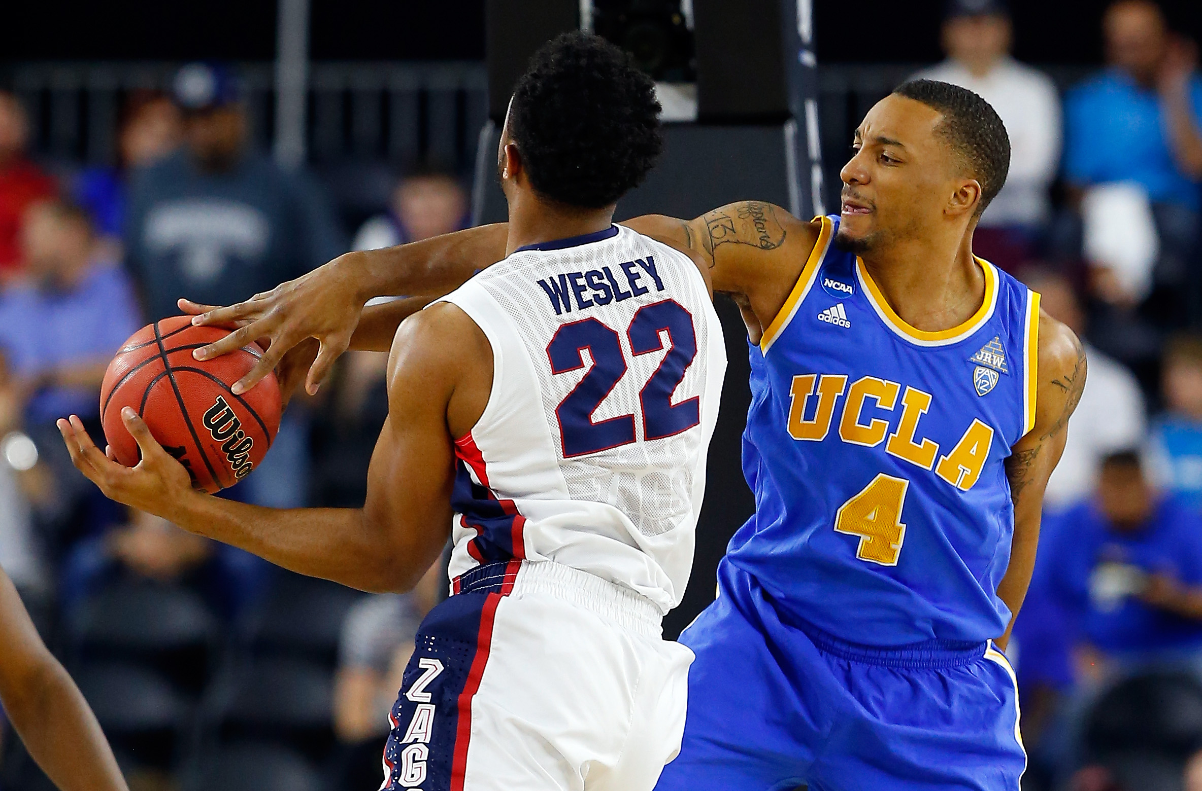 UCLA's Norman Powell defends Byron Wesley during the Bruins' Sweet 16 loss to Gonzaga on March 27. Powell had 16 points, five rebounds and three blocks to end his career at Houston's NRG Stadium. (Tom Pennington/Getty)