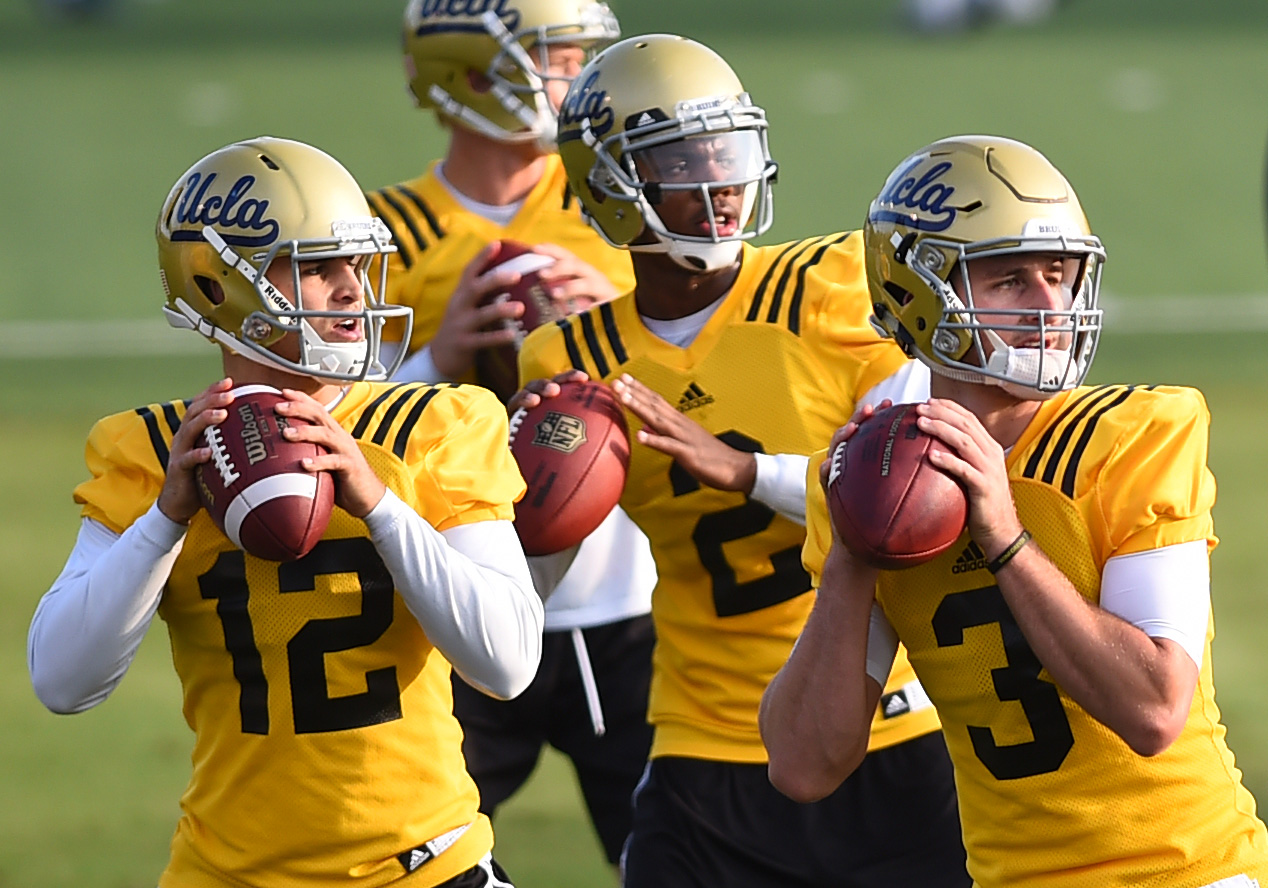 UCLA quarterbacks work on drill during spring football practice at Spaulding Field on April 23, 2015. (Andy Holzman/Staff)