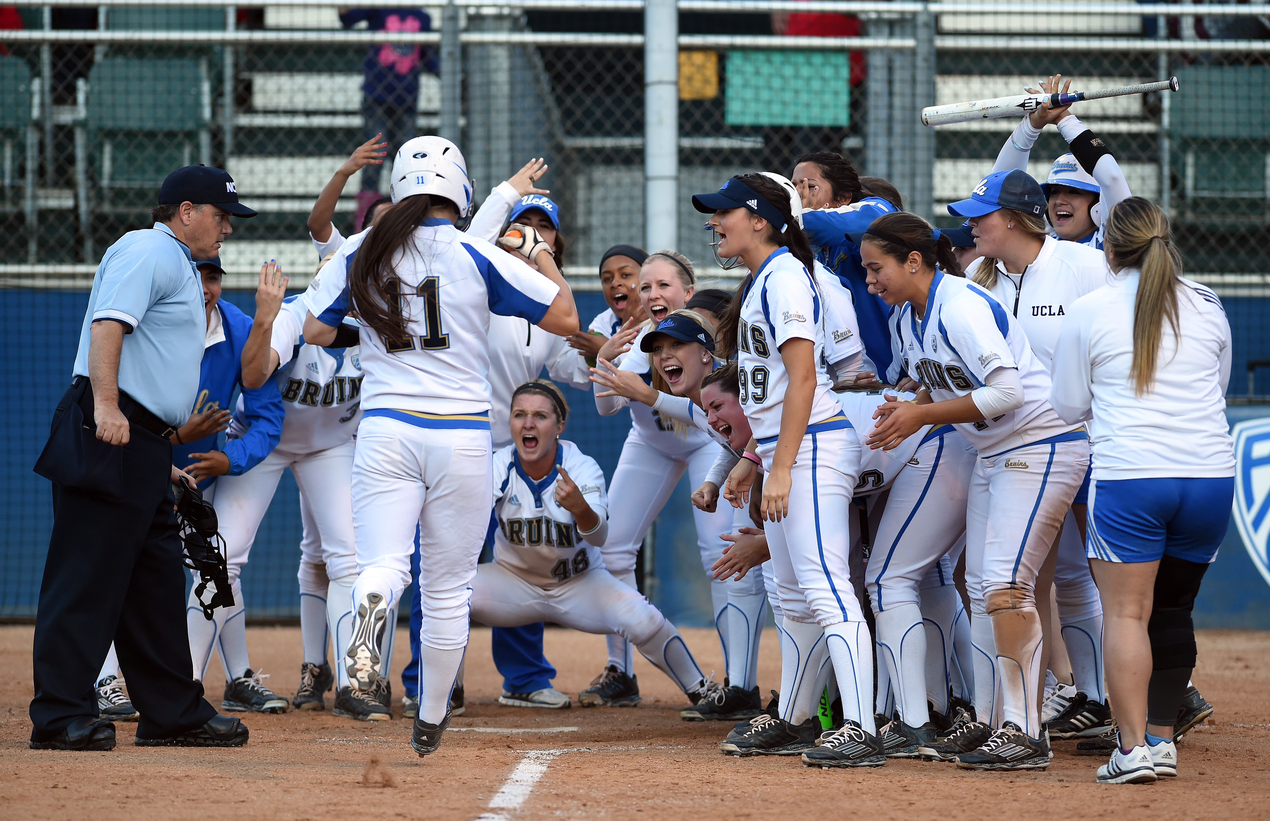 UCLA catcher Stephany LaRosa heads for home plate after hitting a home run during a 9-1 win over CSUN on Friday. The Bruins hit 10 home runs as they swept through their NCAA Regional in three games at  Easton Stadium (Hans Gutknecht/Staff)
