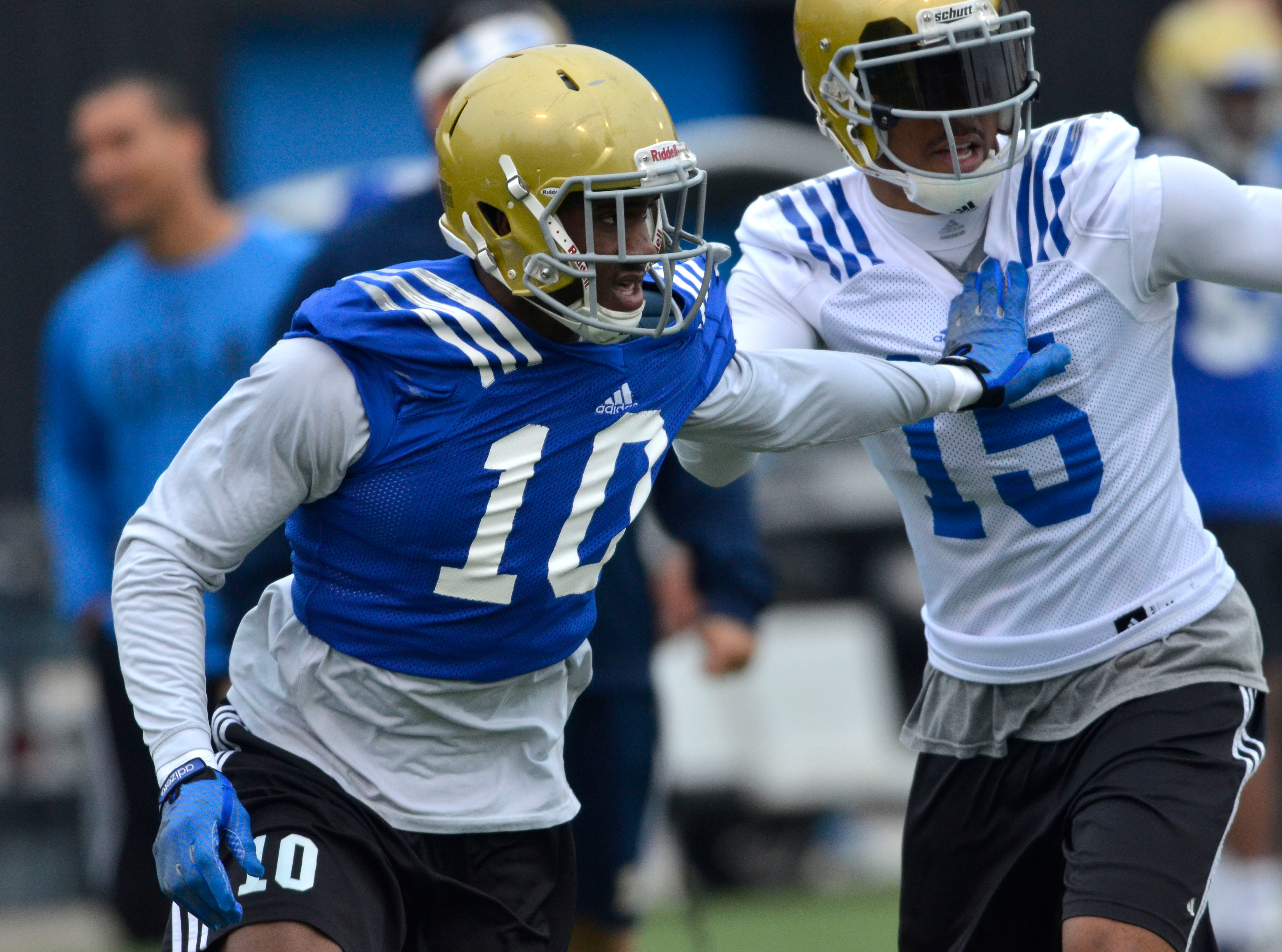 UCLA cornerback Fabian Moreau (10) will help represent the Bruins at Pac-12 Media Days. He is pictured here defending former UCLA receiver Devin Lucien during spring practice on Apr. 16, 2014. (Brad Graverson/Staff)
