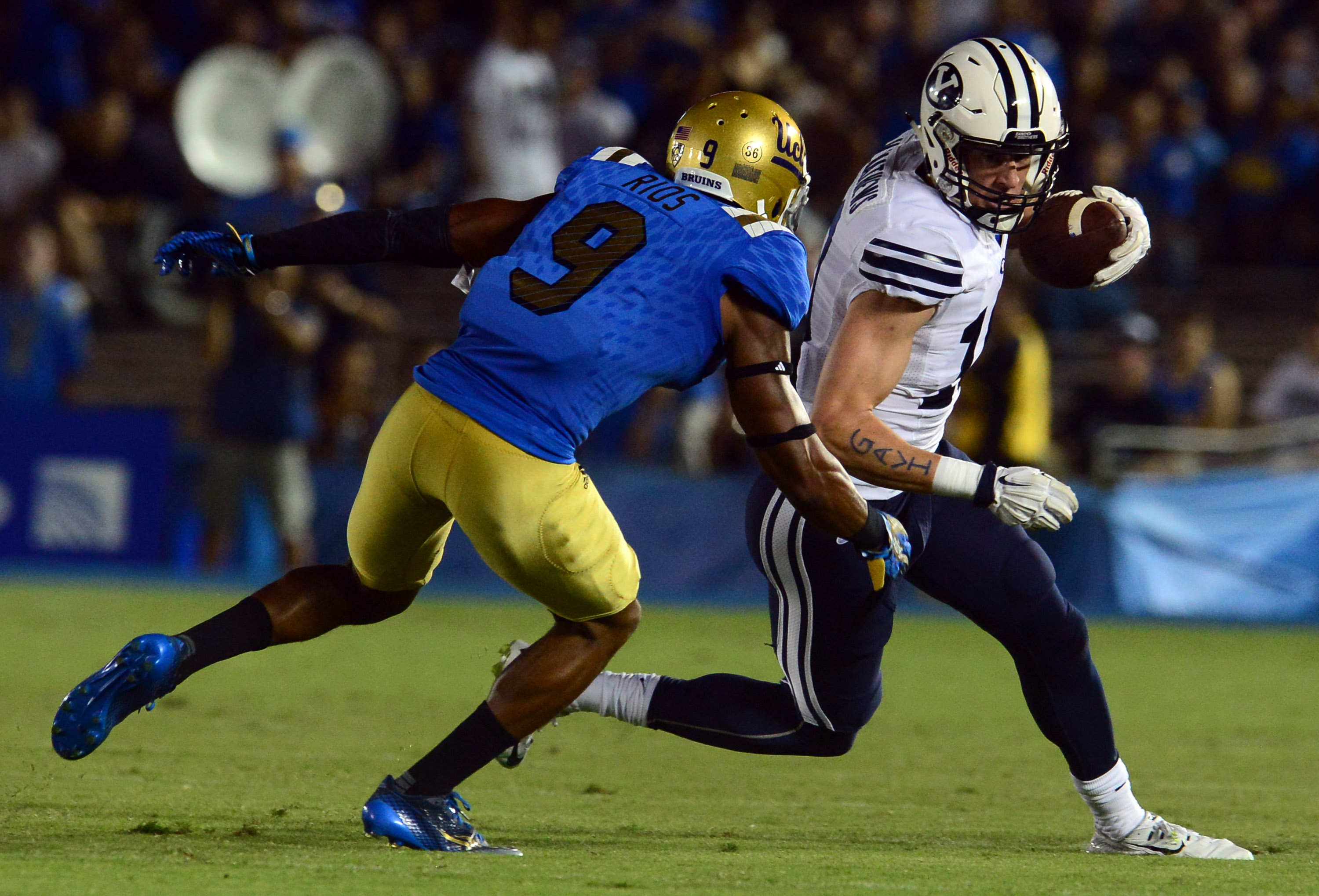 Brigham Young wide receiver Mitch Mathews (10) catches a pass for yardage past UCLA defensive back Marcus Rios (9) in the first half of a NCAA college football game at the Rose Bowl in Pasadena, Calif., Saturday, Sept.19, 2015. (Photo by Keith Birmingham/ Pasadena Star-News)