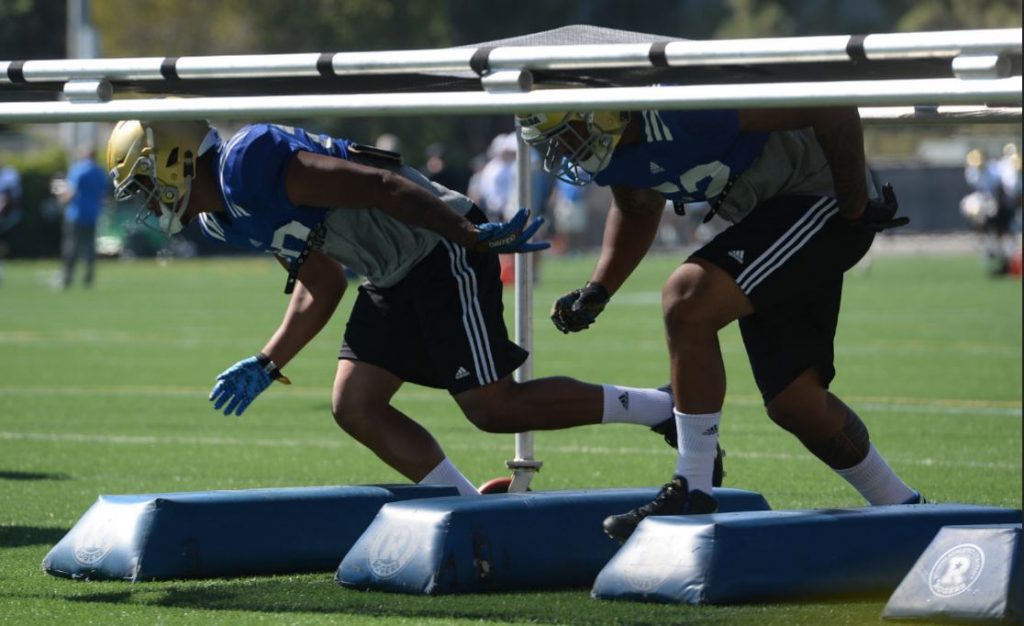 UCLA linebackers work through drills at practice. Photo by Steve McCrank/Staff Photographer