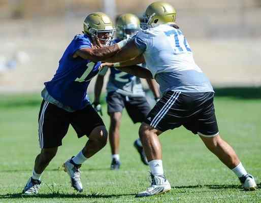 UCLA redshirt freshman defensive end Keisean Lucier-South, left, seen going against Christian Garcia in practice last month, had his coaches raving about his performance against Texas A&M. (Rachel Luna/Staff Photographer)