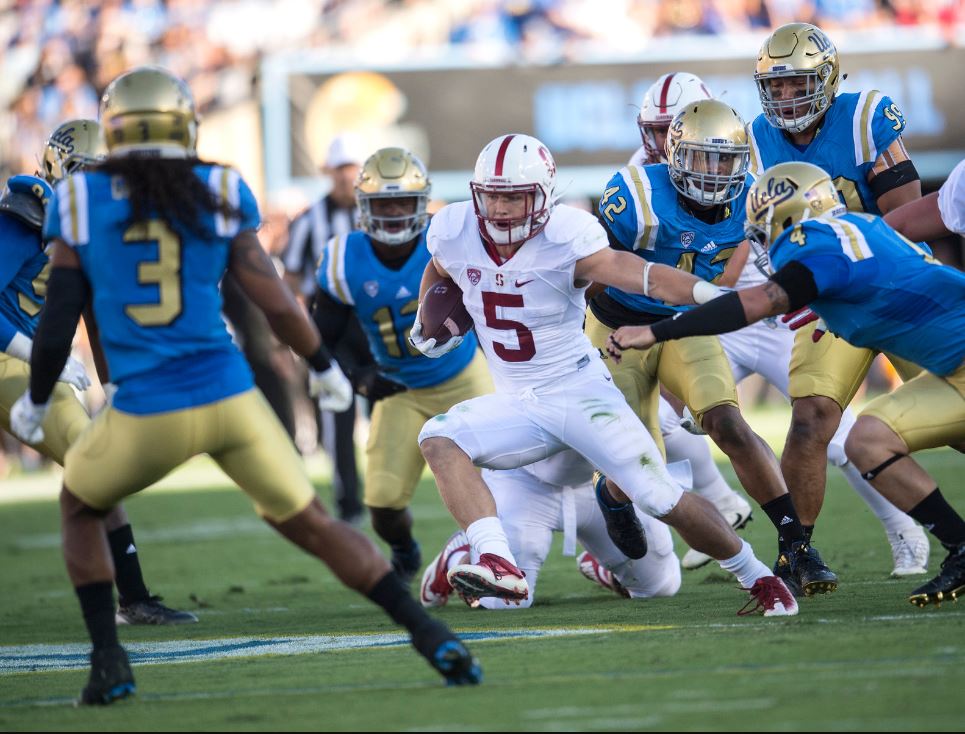 Stanford Cardinal's Christian McCaffrey rumbles for more yards against UCLA Bruins' defense during the first half at Rose Bowl Stadium in Pasadena on Saturday, September 24, 2016. (Photo by Ed Crisostomo, Orange County Register/SCNG)