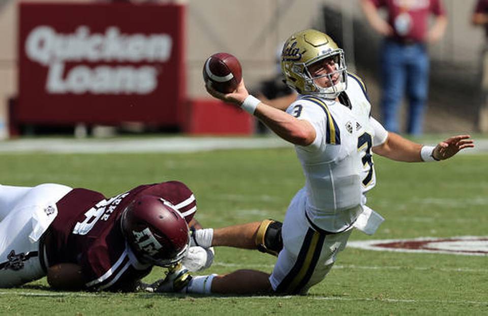 UCLA quarterback Josh Rosen (3) tries to throw the ball out of bounds as he is sacked by Texas A&M defensive lineman Kingsley Keke (88) during the second quarter of an NCAA college football game Saturday, Sept. 3, 2016, in College Station, Texas. Sam Craft AP Photo
