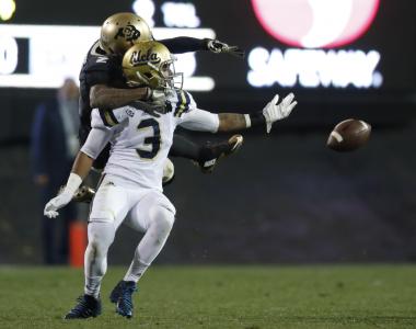 UCLA defensive back Randall Goforth, front, defends Colorado wide receiver Devin Ross during the second half of an NCAA college football game Thursday, Nov. 3, 2016, in Boulder, Colo. Goforth was called for pass interference. Colorado won 20-10. (AP Photo/David Zalubowski)