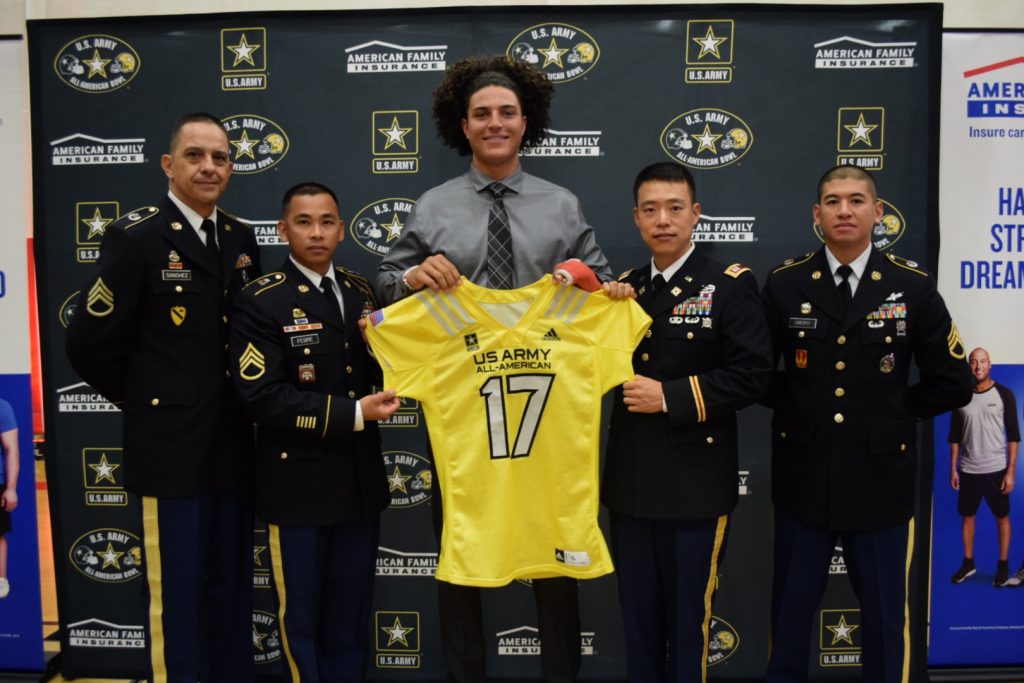 From left to right, SSG Tiki Sanchez, SSG Gil Febre, CAP Tad Kitaguchi and SSG Jonathan Crespo present Jaelan Phillips with his U.S. Army All-American Bowl jersey (Photo: Army All-American Bowl)