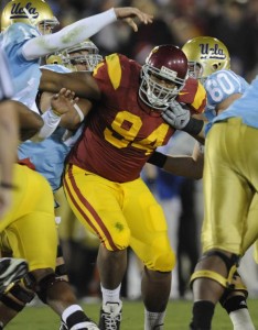 armstead usc armond former reaches settlement player lawsuit his lineman negligence disclosed settled defensive terms medical said were