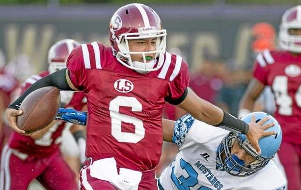 La Serna High QB Enrique Pacheco (#6) breaks a tackle in the first quarter vs Ralston Valley (Colorado) at Whittier College Stadium August 28, 2014. (Photo by Leo Jarzomb/Whittier Daily News) 