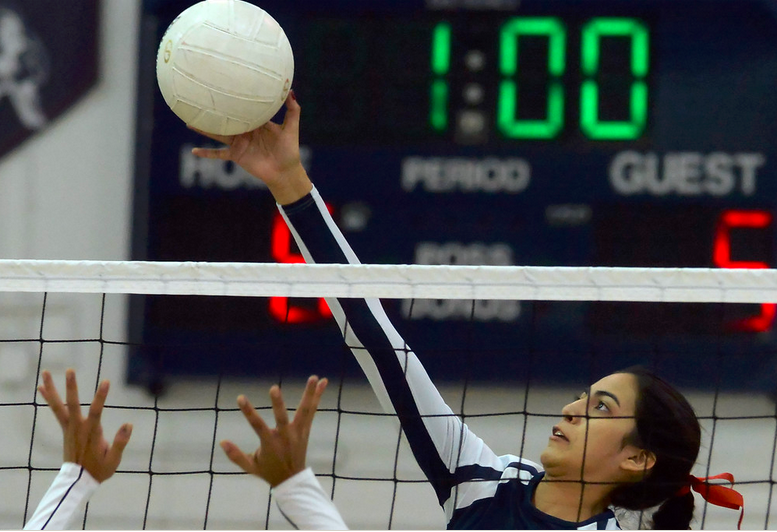St. Paul's Hannah Tostado scores against Elizabeth in the first game of a CIF State volleyball playoff game at St Paul Catholic High School in Santa Fe Springs, Calif., Tuesday, Nov. 25, 2014. (Photo by Keith Birmingham/ Pasadena Star-News) 