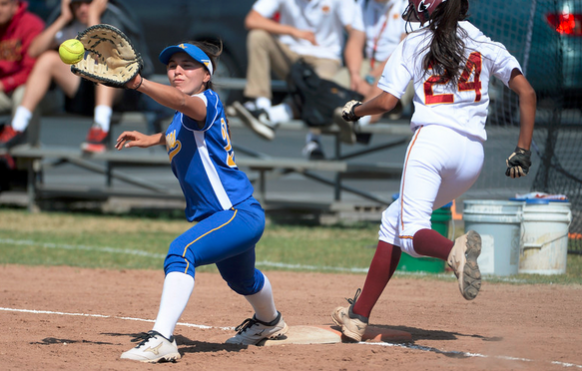 Cantwell's Alyssa Del Campo (24) is called out at first base, but appears to beat the throw as Bishop Amat's Julia Menrad waits for the ball in the first inning of a prep softball game at Cantwell Sacred Heart of Mary High School in Montebello, Calif., Thursday, April 30, 2015. Bishop Amat won 17-0. (Photo by Keith Birmingham/ Pasadena Star-News)