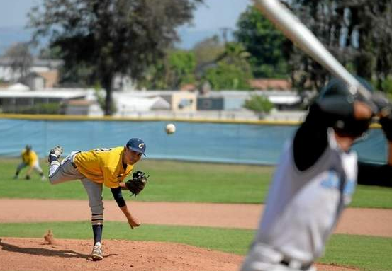 California High School's Daniel Alvarez, left, pitches to San Gorgonio High School's Miguel Arauz during a CIF playoff game on Friday, May 29, 2015 in San Bernardino, Calif. The Condoras rallied for a 4-1 win to advance to the semifinals. (Micah Escamilla/The Sun) 
