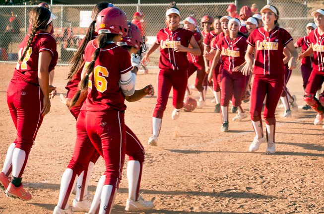  La Serna High players jubilate after their win over Redondo High in the bottom of the 12th inning at La Serna's Whittier, Calif. campus field May 28, 2015. (Photo by Leo Jarzomb/Whittier Daily News) 
