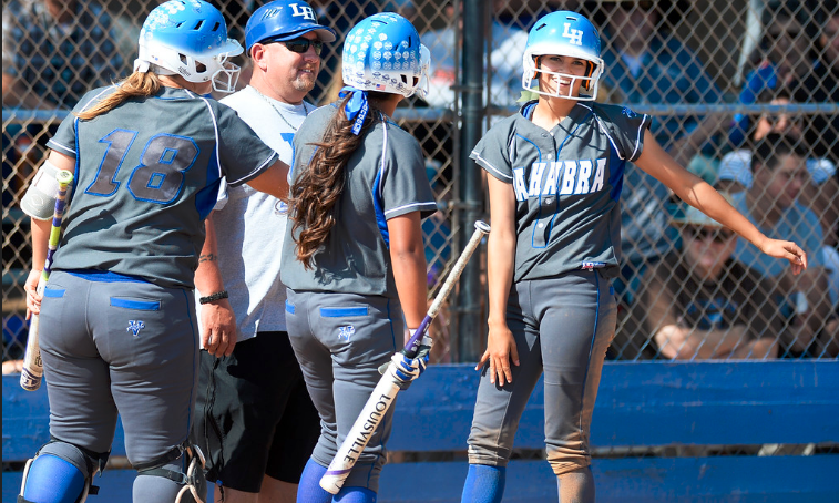 La Habra's Kira Cauley (5) is congratulated after stealing second and third bases in the same play as they play Rio Mesa in their CIF girls softball playoff game at La Habra High School in La Habra on Thursday May 26, 2016. (Photo by Keith Durflinger/Whittier Daily News)